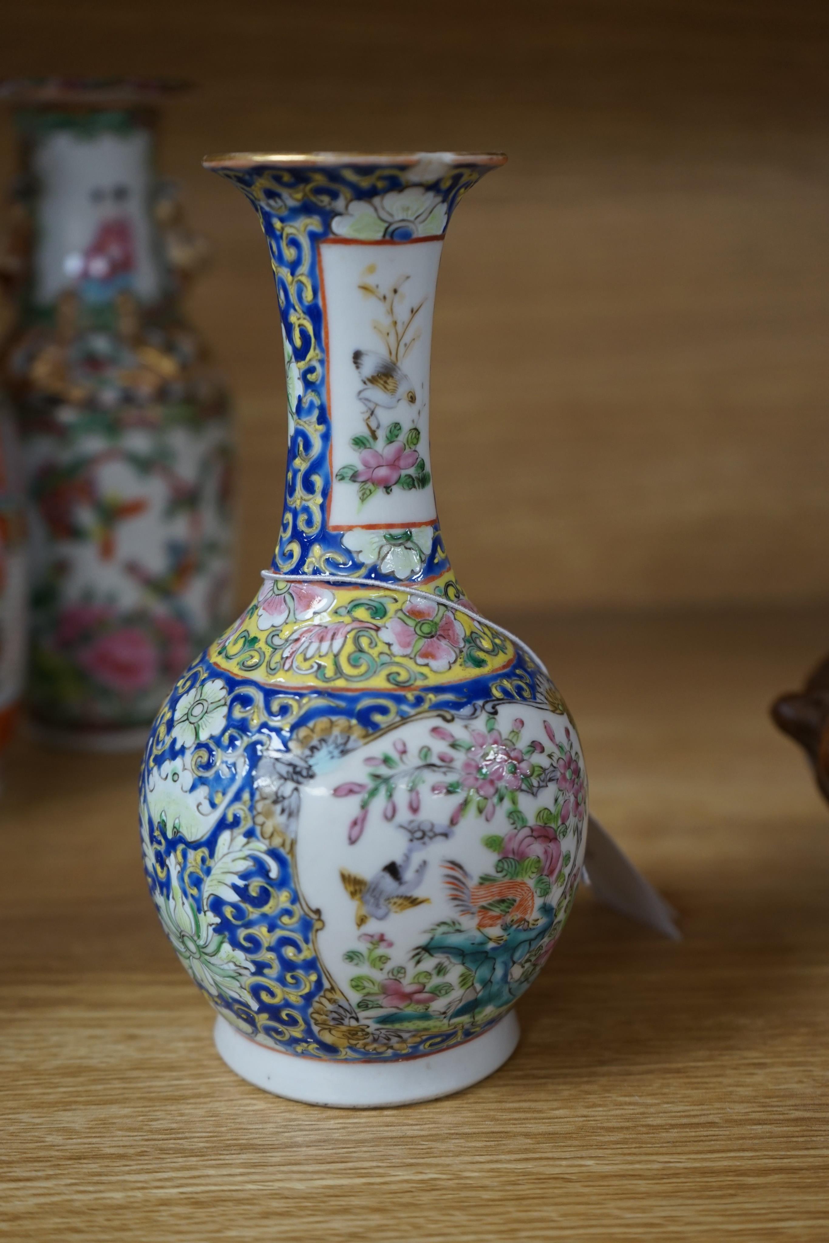Four 19th century Chinese famille rose vases, 21cm